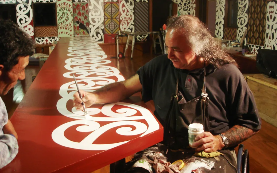 David Cameron paintingthe kowhaiwhai patterns on the Te Poho o Hiraina Marae in Gisborne which he spent 12 years working on.